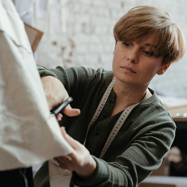 Costume designer cutting fabric
