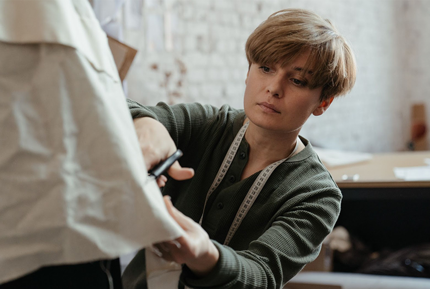 Costume designer cutting fabric