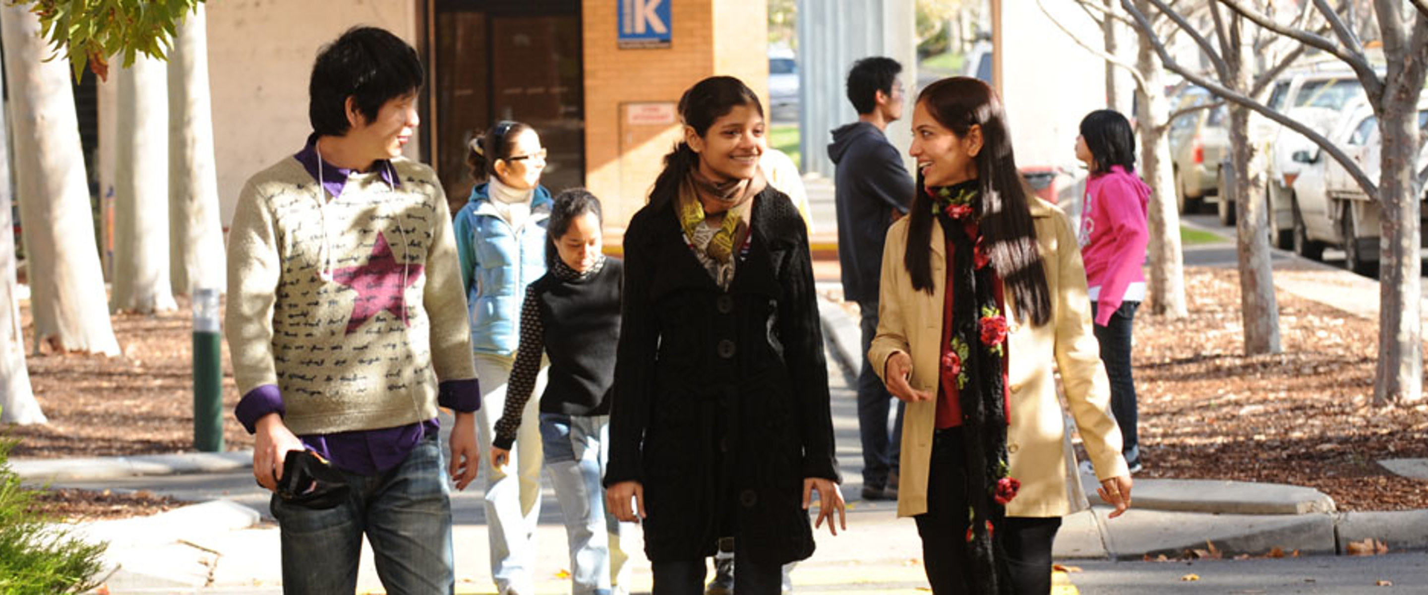 Students walking on path and talking 