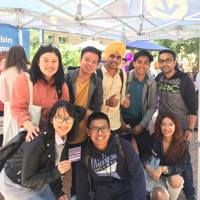Group of international Melbourne Polytechnic students posing for photo on campus
