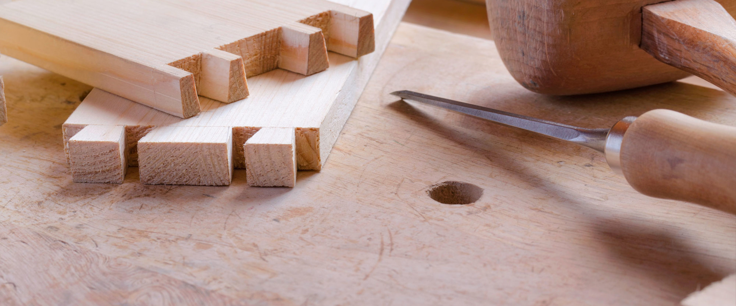 Wooden planks sitting on a desk with other tools