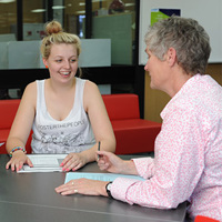 Student Support Services, advisor and student at table