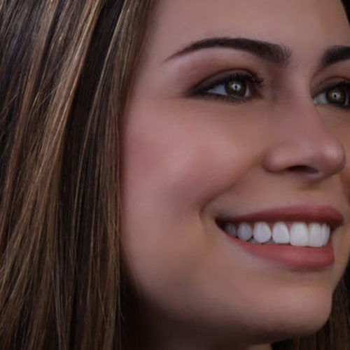 Close-up of woman smiling and looking to side