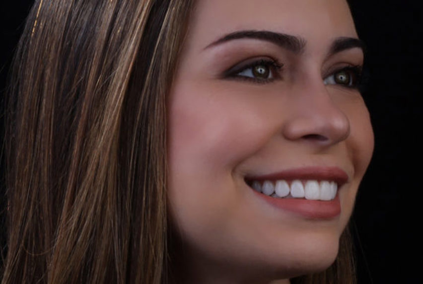 Close-up of woman smiling and looking to side