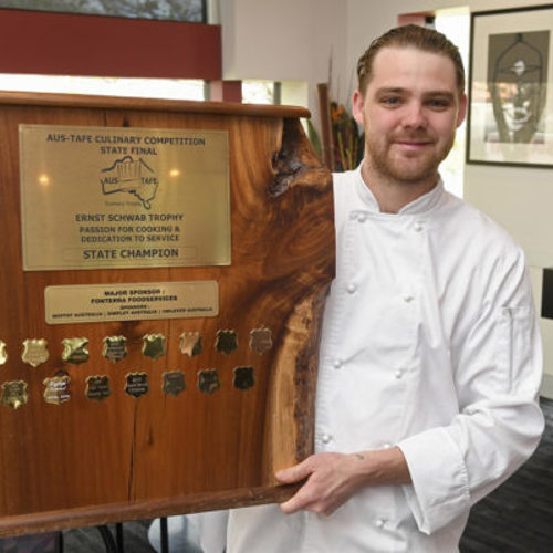 image of Jakeb Jesser holding trophy