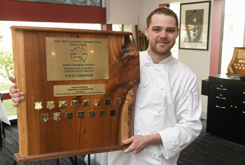 image of Jakeb Jesser holding trophy