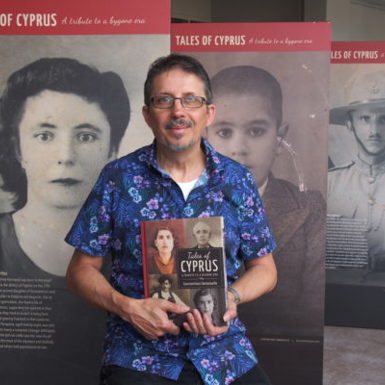 Con Emmanuelle standing with his book