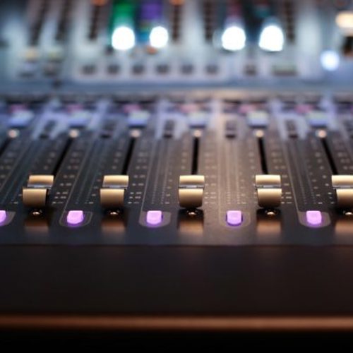 Close-up of audio mixing desk