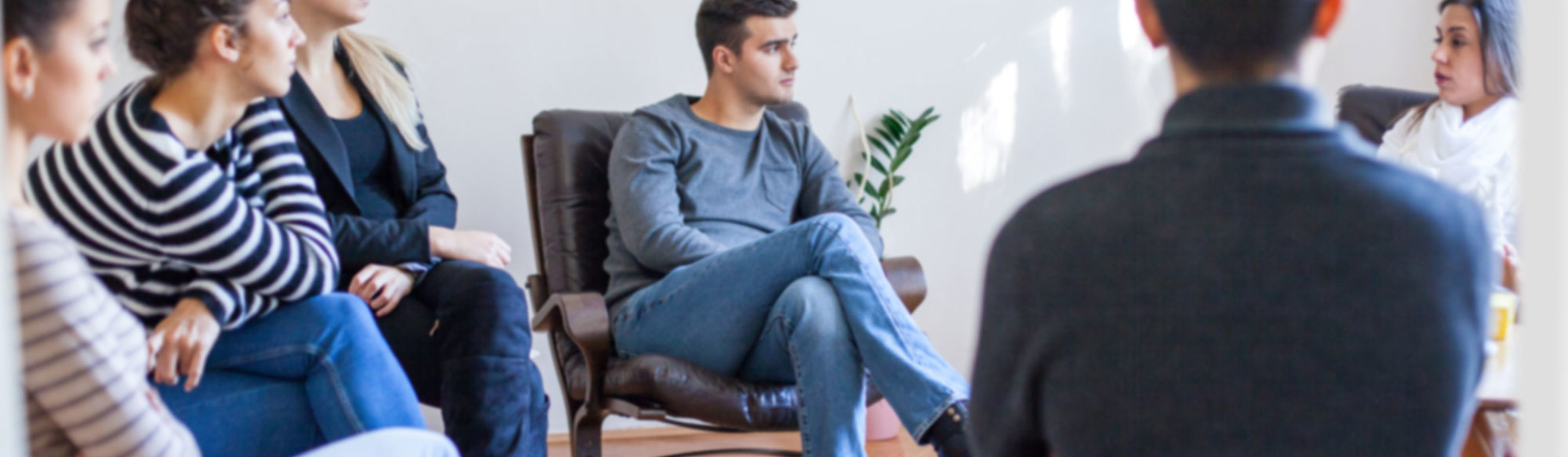 NDIS study area image - A group of people sitting in a circle and listening to one another talk