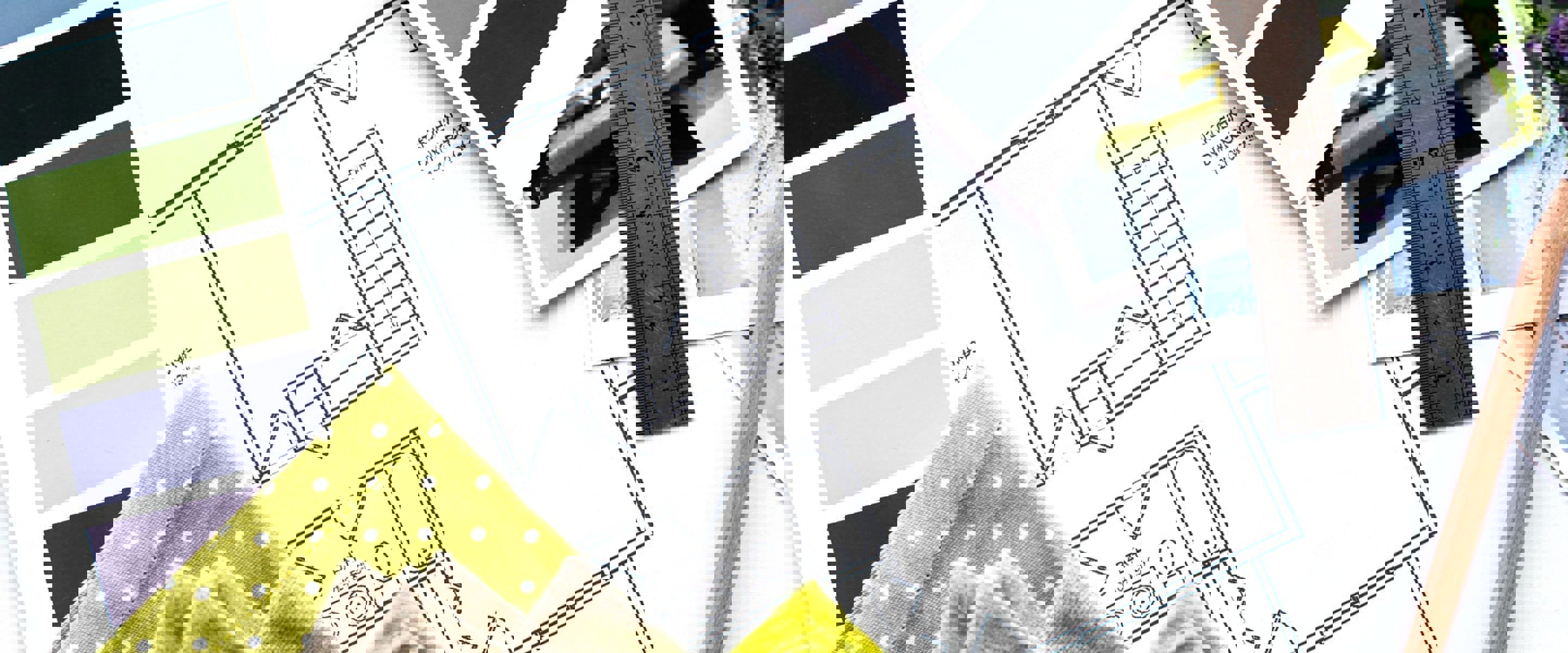 Paint colour and fabric samples placed over blueprints of a house