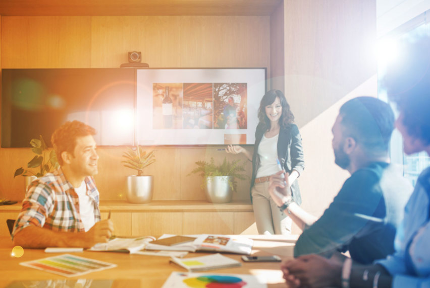 A group of people having a team discussion in an office