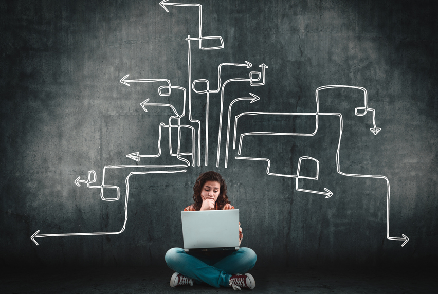 Arrows coming of thinking person representing possible pathways