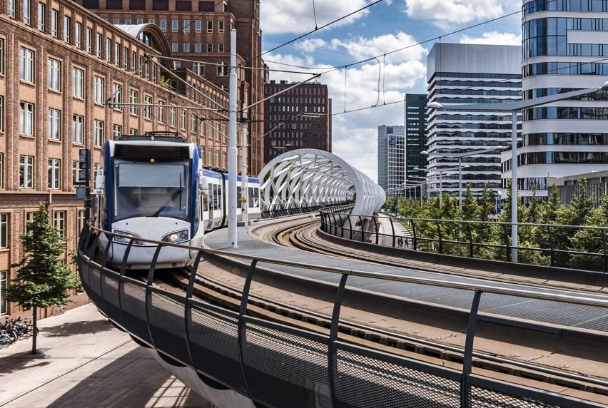 train traveling above road in Melbourne City