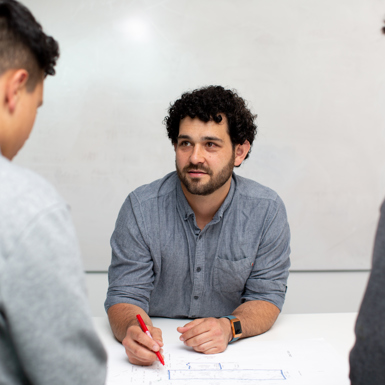 Building design student with drawing