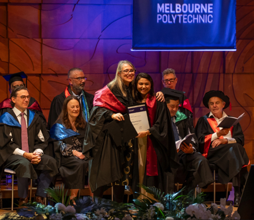 Bhagyashree Patel posing with testmur at Melbourne Polytechnic Graduation Ceremony