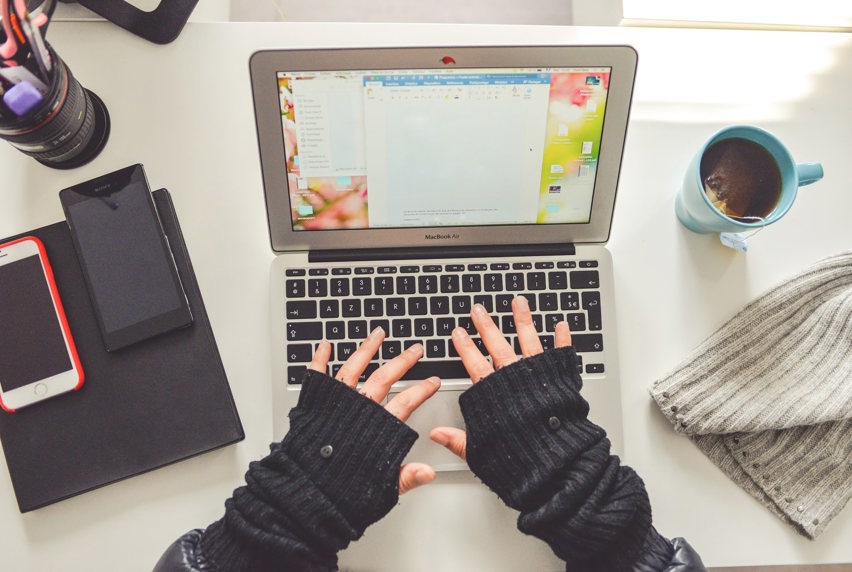 top-down view of someone using a laptop