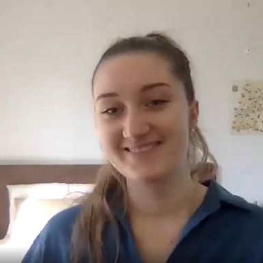 Portrait of woman on video call in bedroom