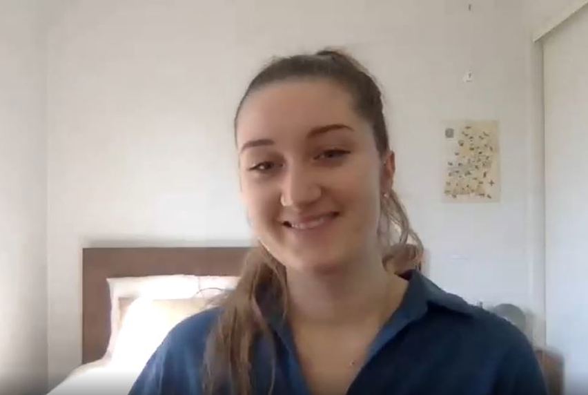 Portrait of woman on video call in bedroom