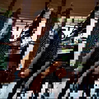 Portrait of musician sitting next to a piano