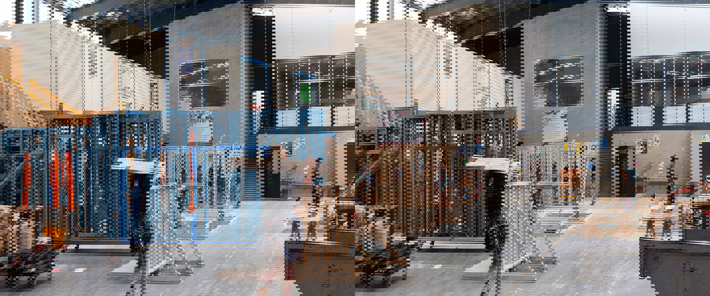 Heidelberg campus Construction students working in outdoor practical study area with steel and timber building frames