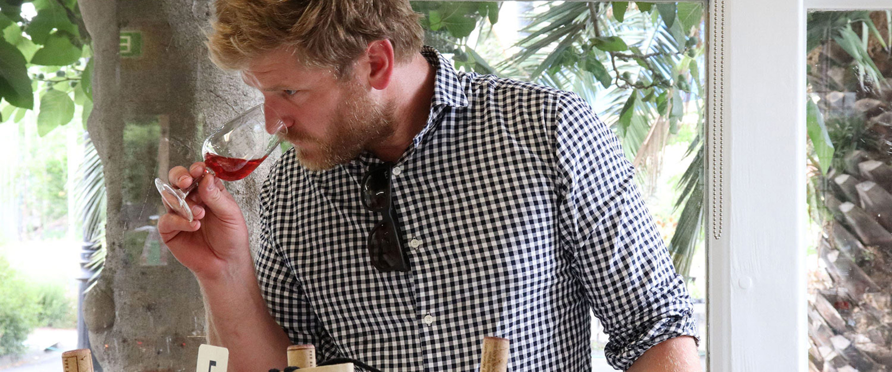 Man sniffing wine at one of Melbourne Polytechnic's one of two wineries.