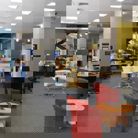 Work stations and meeting tables inside Melbourne Polytechnic's Prahan library