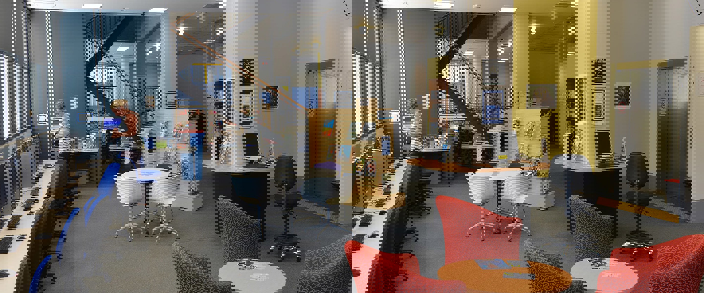 Work stations and meeting tables inside Melbourne Polytechnic's Prahan library