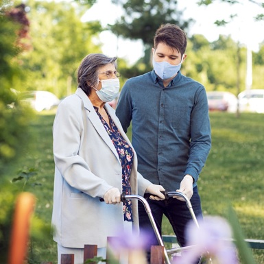 Elderly woman using walker