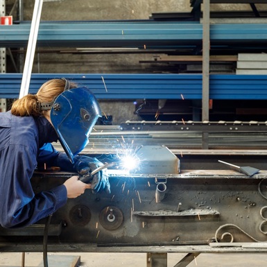 Image of woman welding