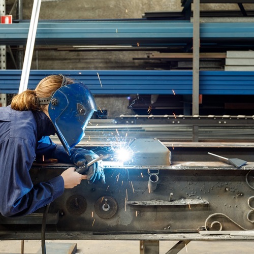 Image of woman welding