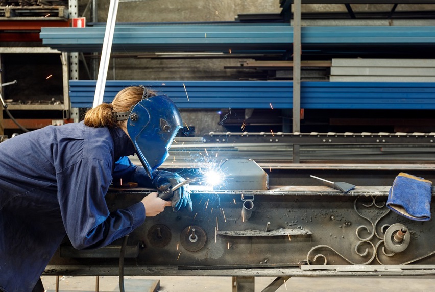 Image of woman welding