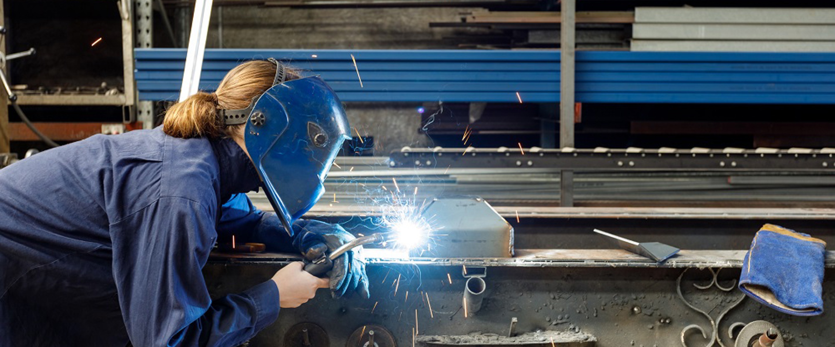 Image of woman welding