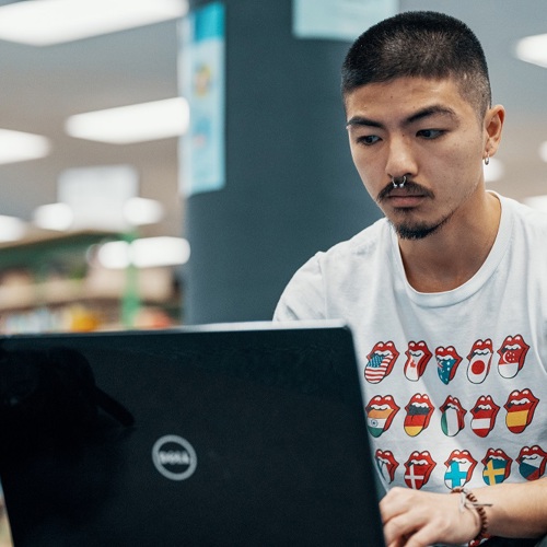 Max using a laptop