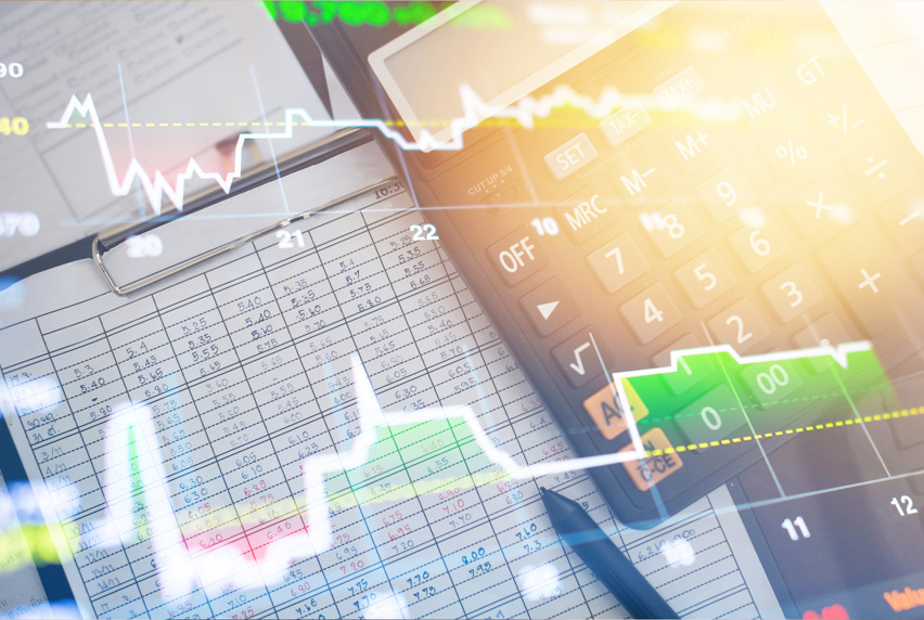 Accounting notebook and calculator with graph overlay