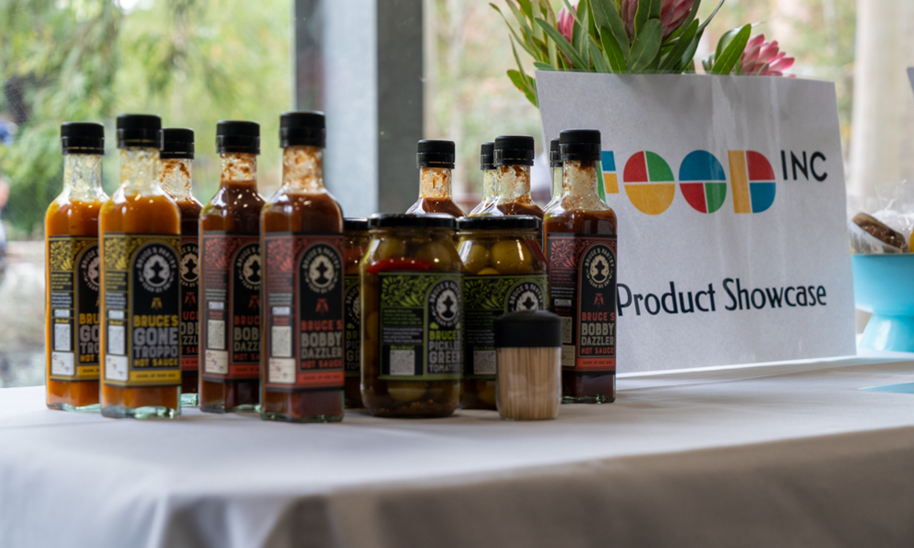 Packaged and baked food products on a table with brochures and baked food products on a table with brochures