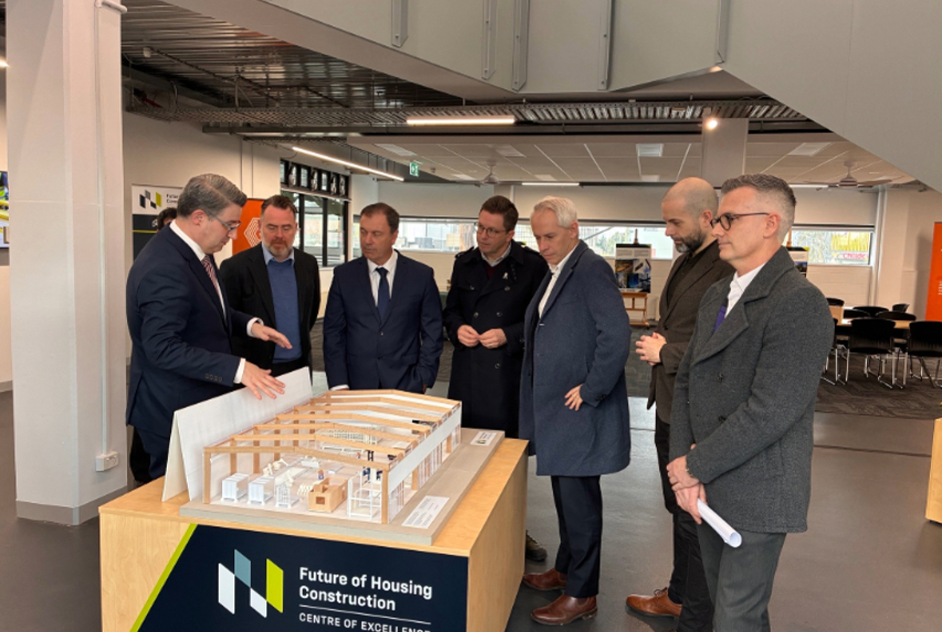 L - R: Gabriel Solorzano Torres (MP), Damien Crough (prefabAUS), Minister Colin Brooks, Vic Member for Ivanhoe Anthony Carbines, Minister Andrew Giles, Alex White (Vic TAFE Association), Philip Wyles (MP)