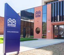 The Collingwood Campus entrance, displaying a blue sign that states "Melbourne Polytechnic."