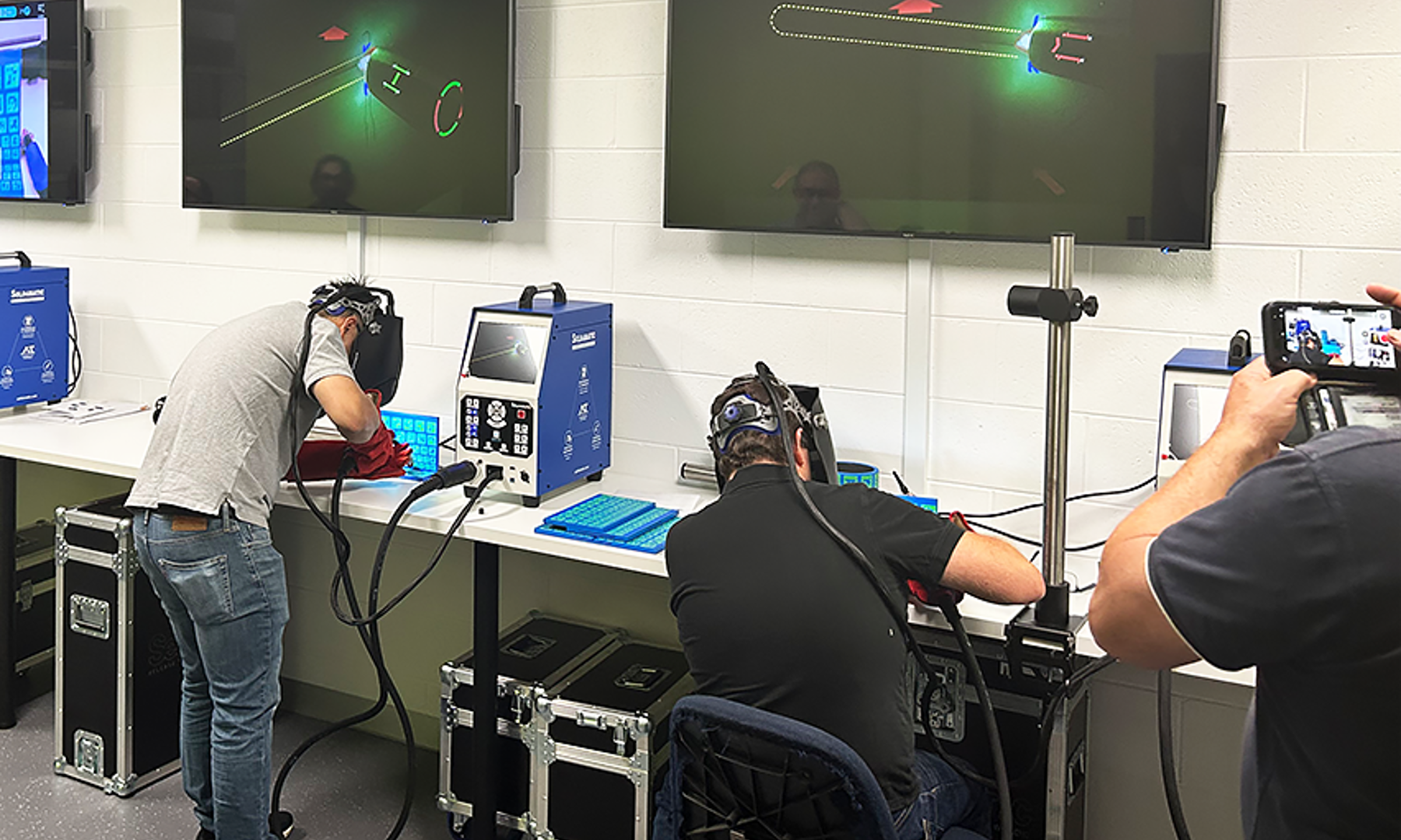Students and Staff practice on the Virtual Welders