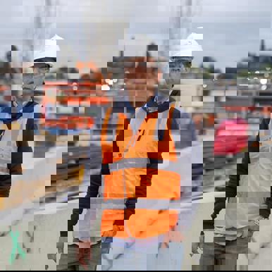 Reza, OQP student, wearing hi vis on a building site