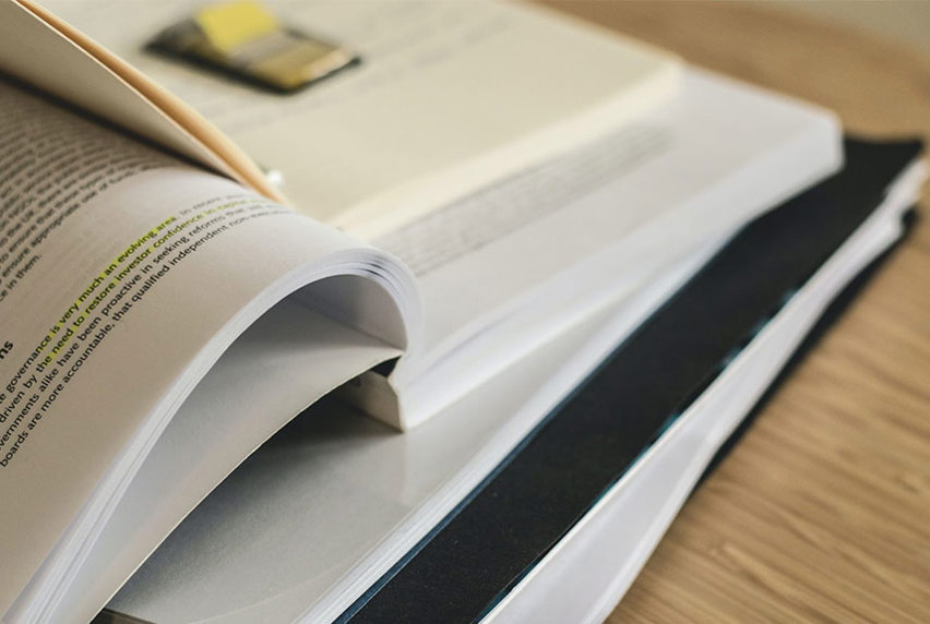 A stack of books on a table.