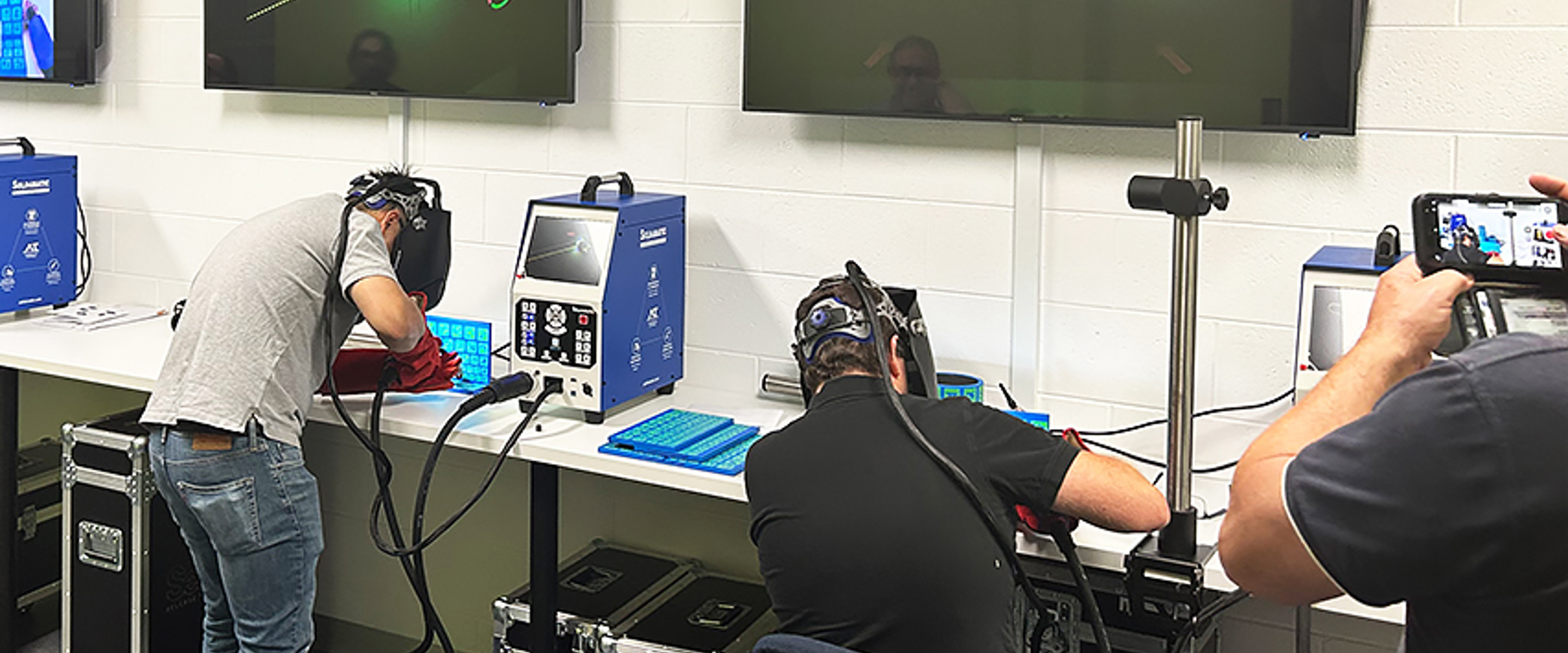Students and Staff practice on the Virtual Welders