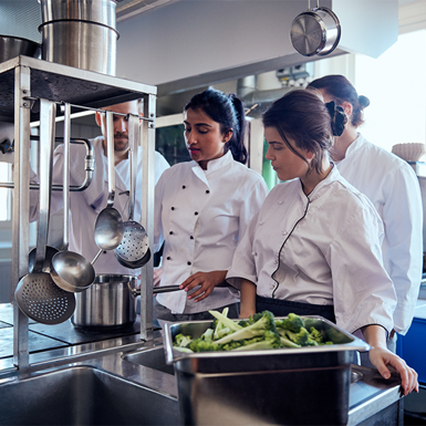 Commercial Cookery students learning in a commercial kitchen