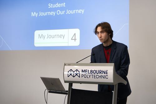 Lukas Duffy giving presentation at a lectern