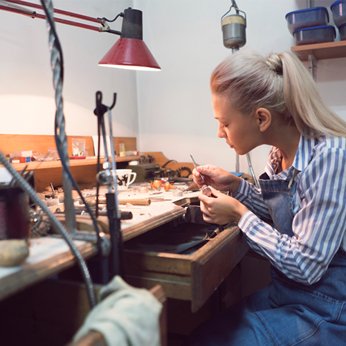 Skilled jewellery maker crafting her pieces