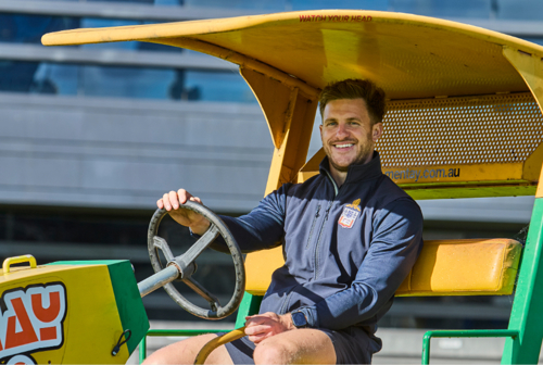 Matt Reinhard driving a vehicle.