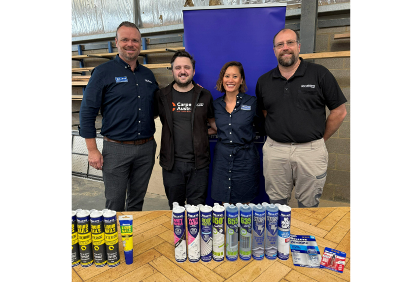 Team members from Selleys, Carpentry Australia and Melbourne Polytechnic pose together at the 2025 Selleys Stick With It Scholarship awards, standing behind a table displaying a range of Selleys products.