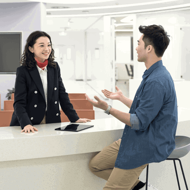 A woman and a man in discussion in an office