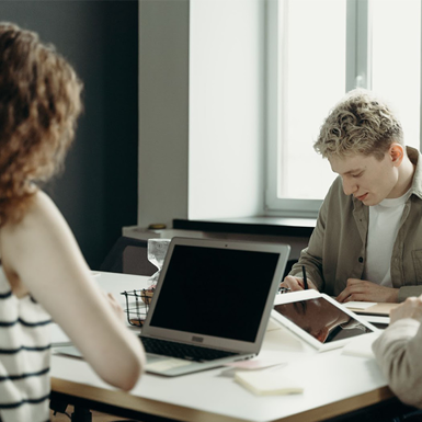 Professional training assessor helping students with their work and study requirements